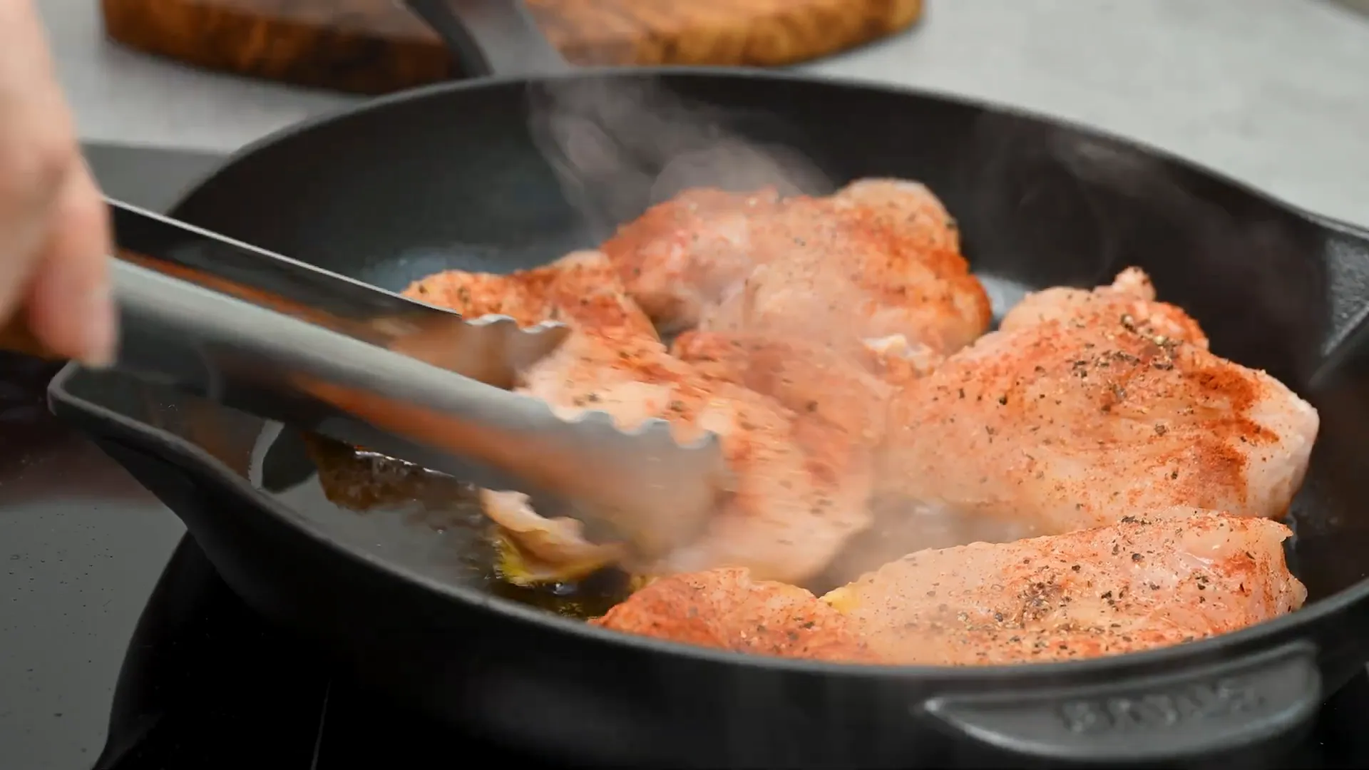 Frying chicken breast fillets in olive oil