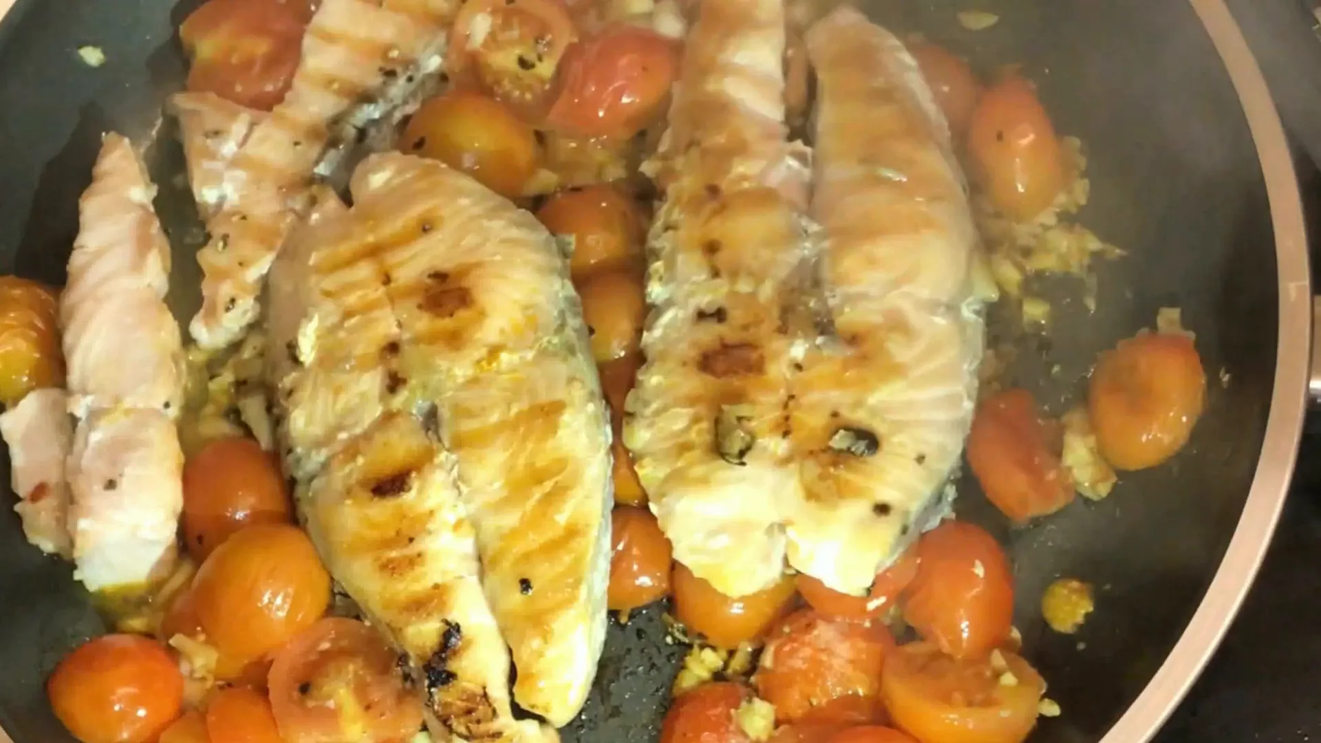 Salmon with lemon and herbs on a plate