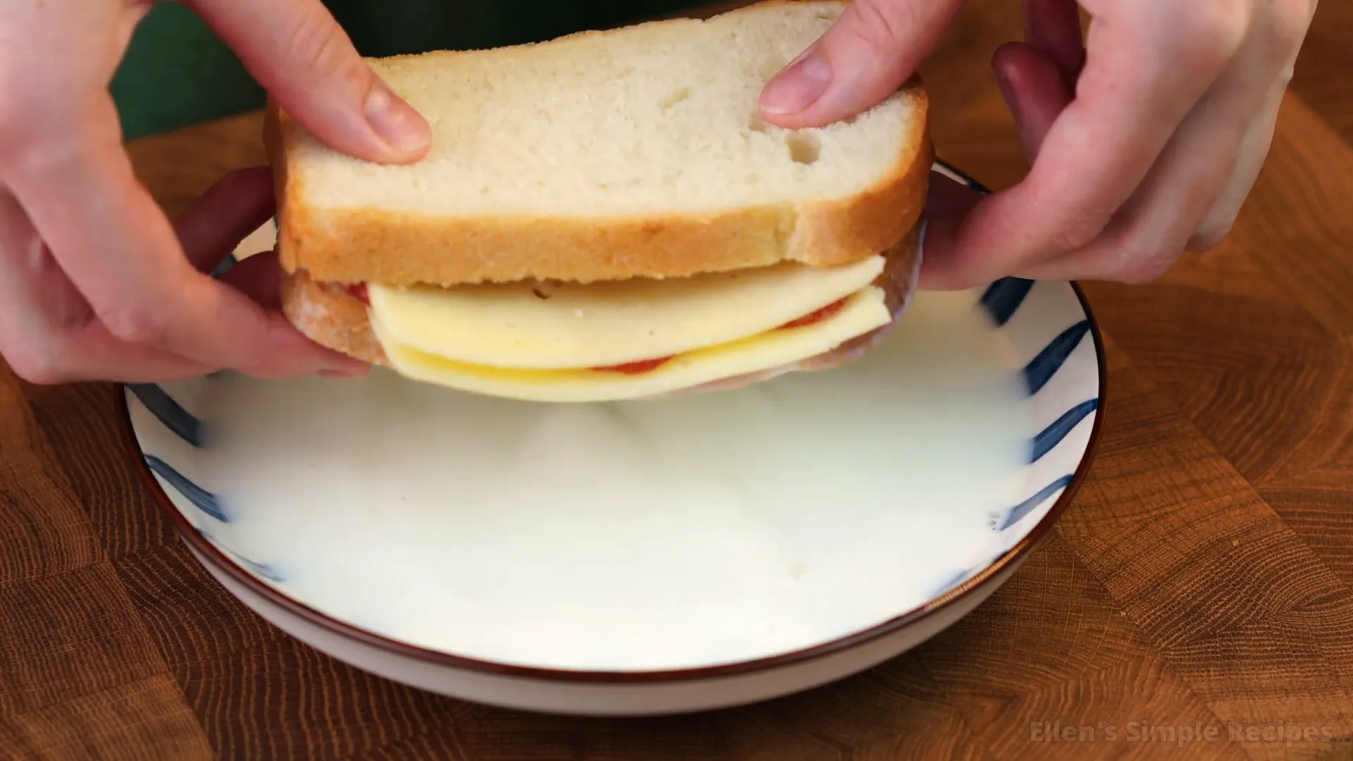 A cup of milk ready to be used in the sandwich preparation