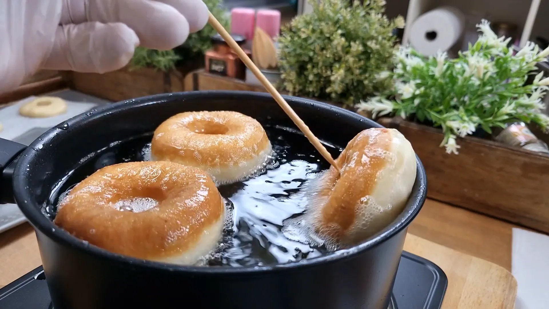 Frying donuts in hot oil